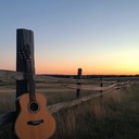 serene guitar notes drift over empty, sun soaked landscapes