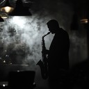 a sinister lounge melody echoing through smoke filled, silent halls.