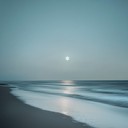 gentle waves lap under moonlit sky's serene embrace.